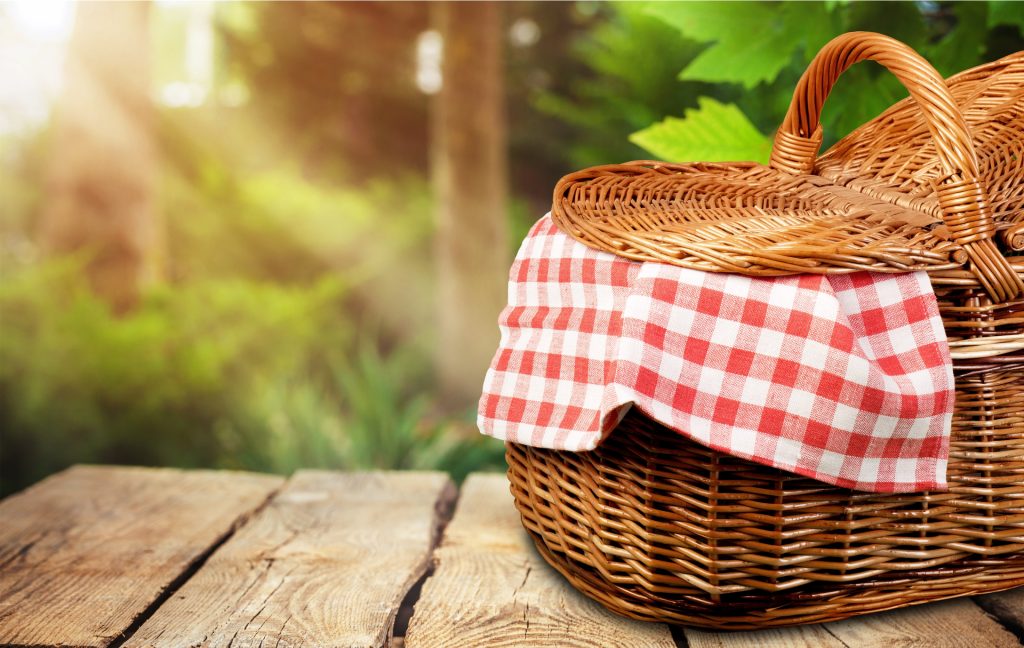 Picnic Basket with napkin on nature background